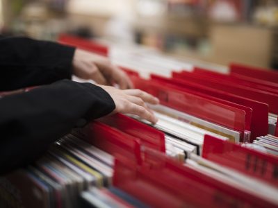 close-up-young-man-looking-vinyls-store